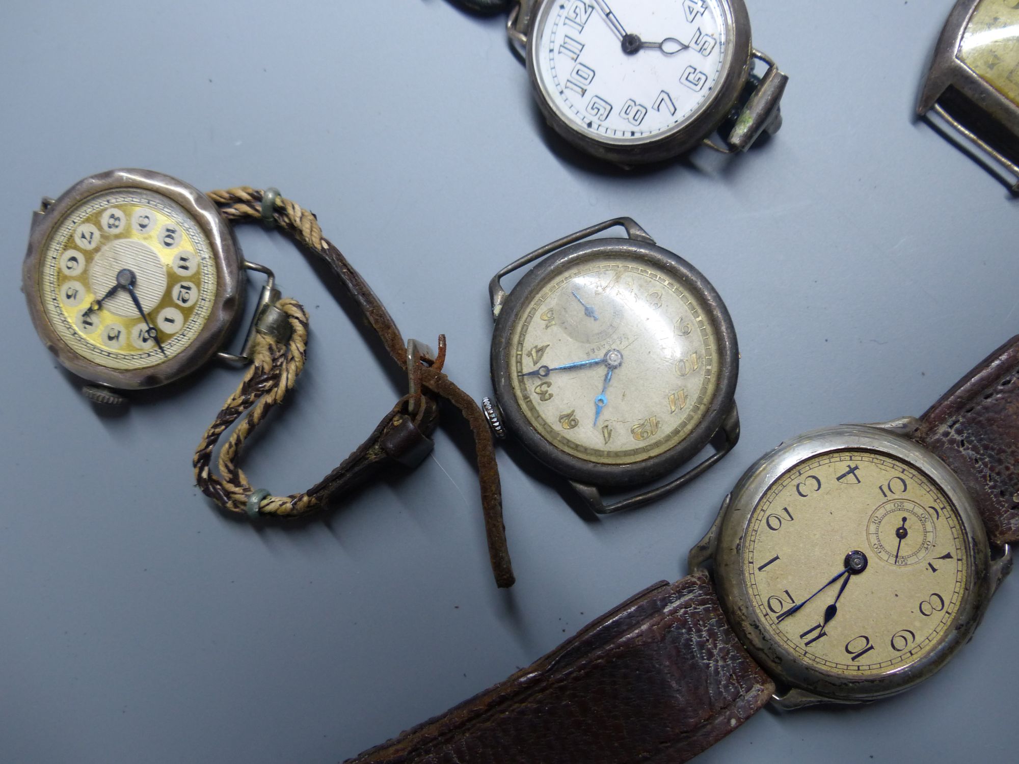 Eight assorted early to mid 20th century silver and white metal wrist watches (a.f.).